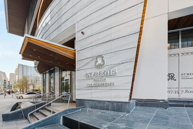 a dining room with furniture and a floor to ceiling window