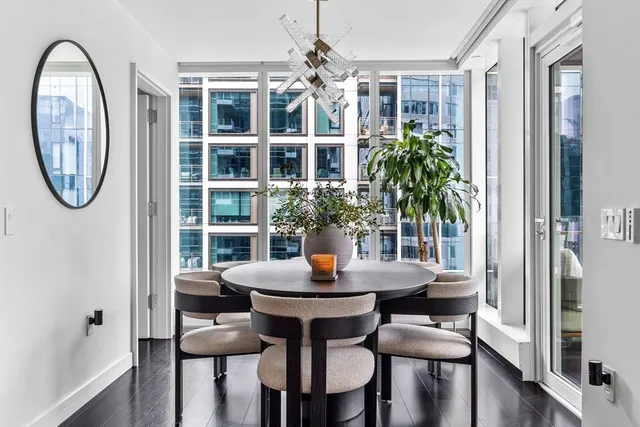 a view of a dining room with furniture and window