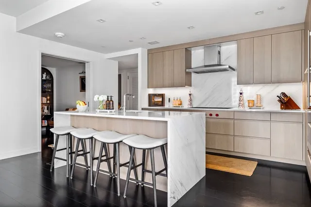 a kitchen with stainless steel appliances granite countertop a sink and cabinets