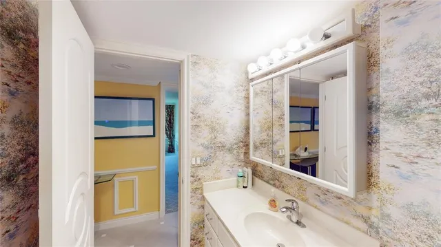 a bathroom with a tub and a sink