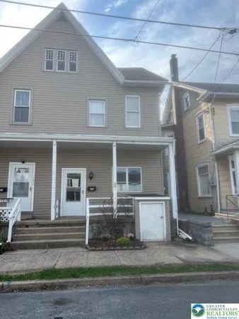 a front view of a house with garage