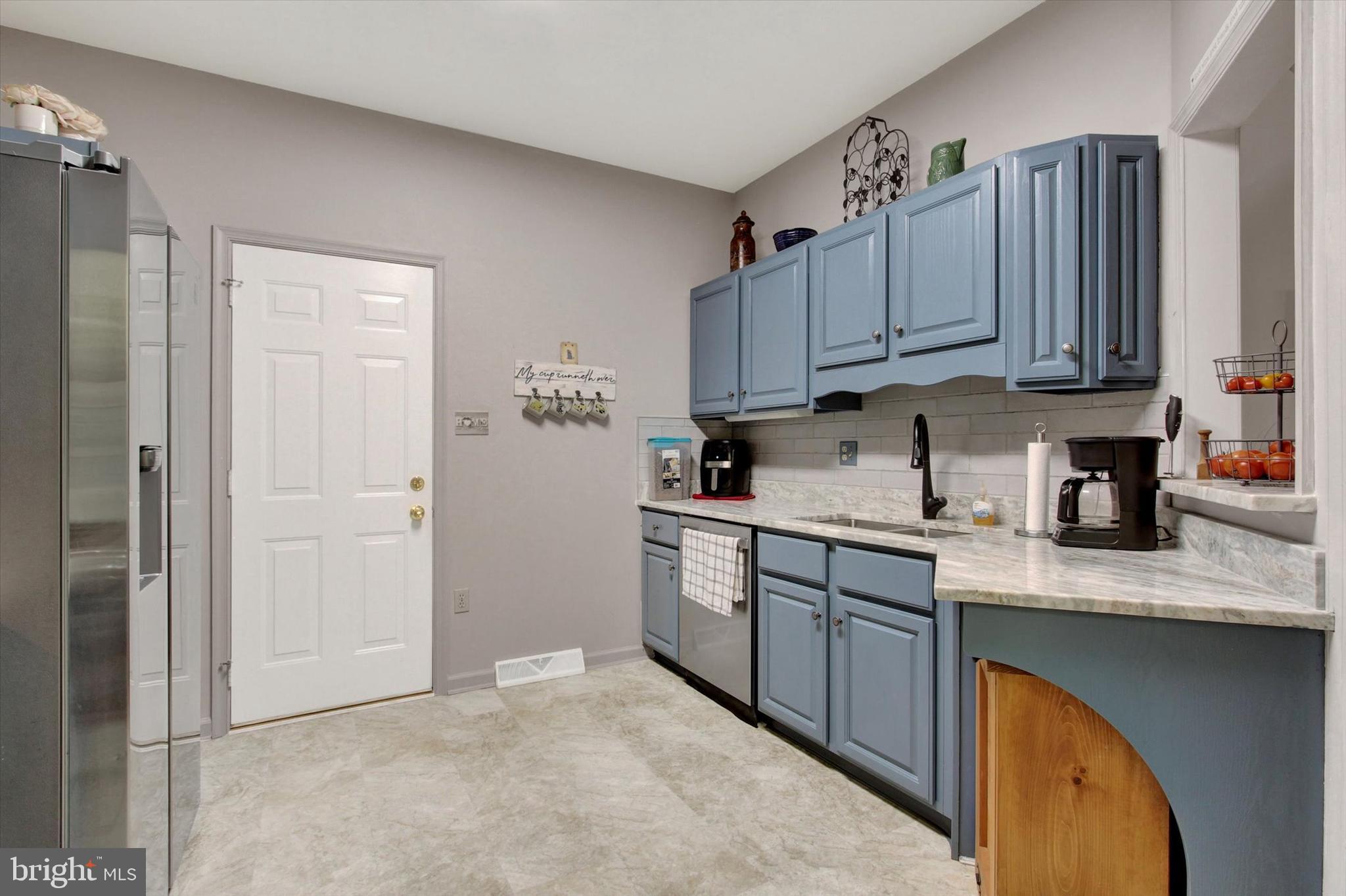 67 Hunters Trail Gettysburg, PA 17325 - Photo 12 of 30 a kitchen with stainless steel appliances granite countertop a sink stove and cabinets