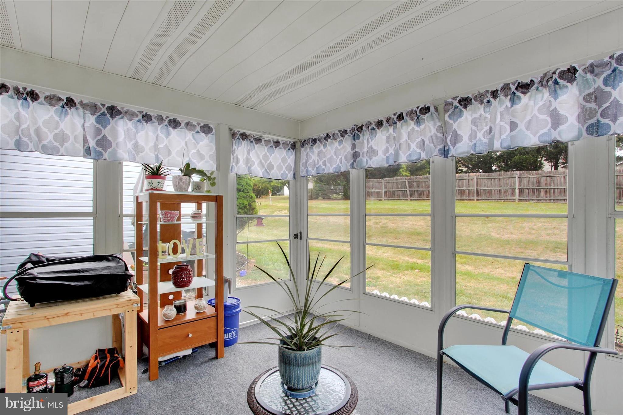 67 Hunters Trail Gettysburg, PA 17325 - Photo 24 of 30 a living room with furniture and a floor to ceiling window