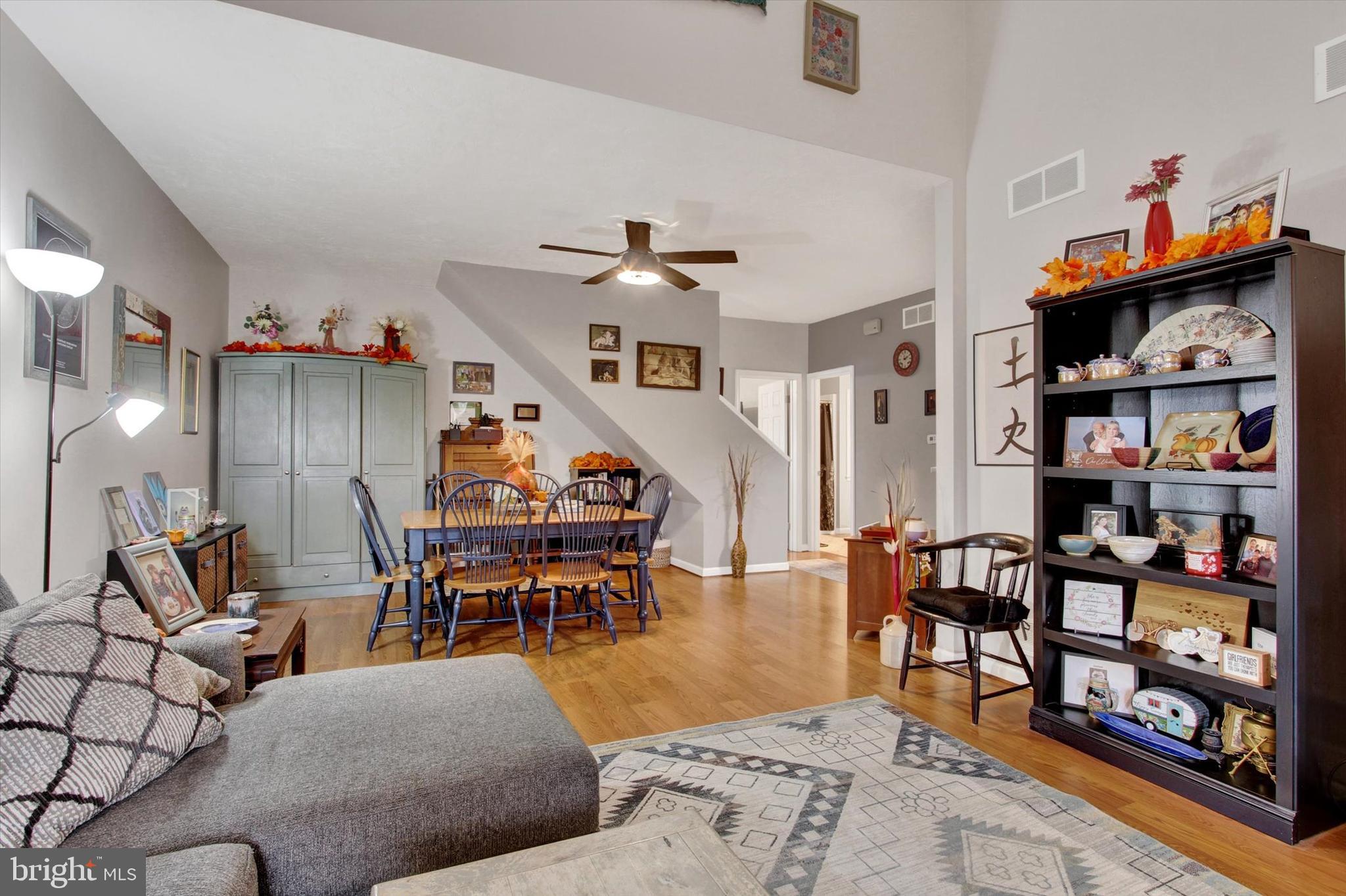 67 Hunters Trail Gettysburg, PA 17325 - Photo 6 of 30 a living room with furniture a rug and a bookshelf