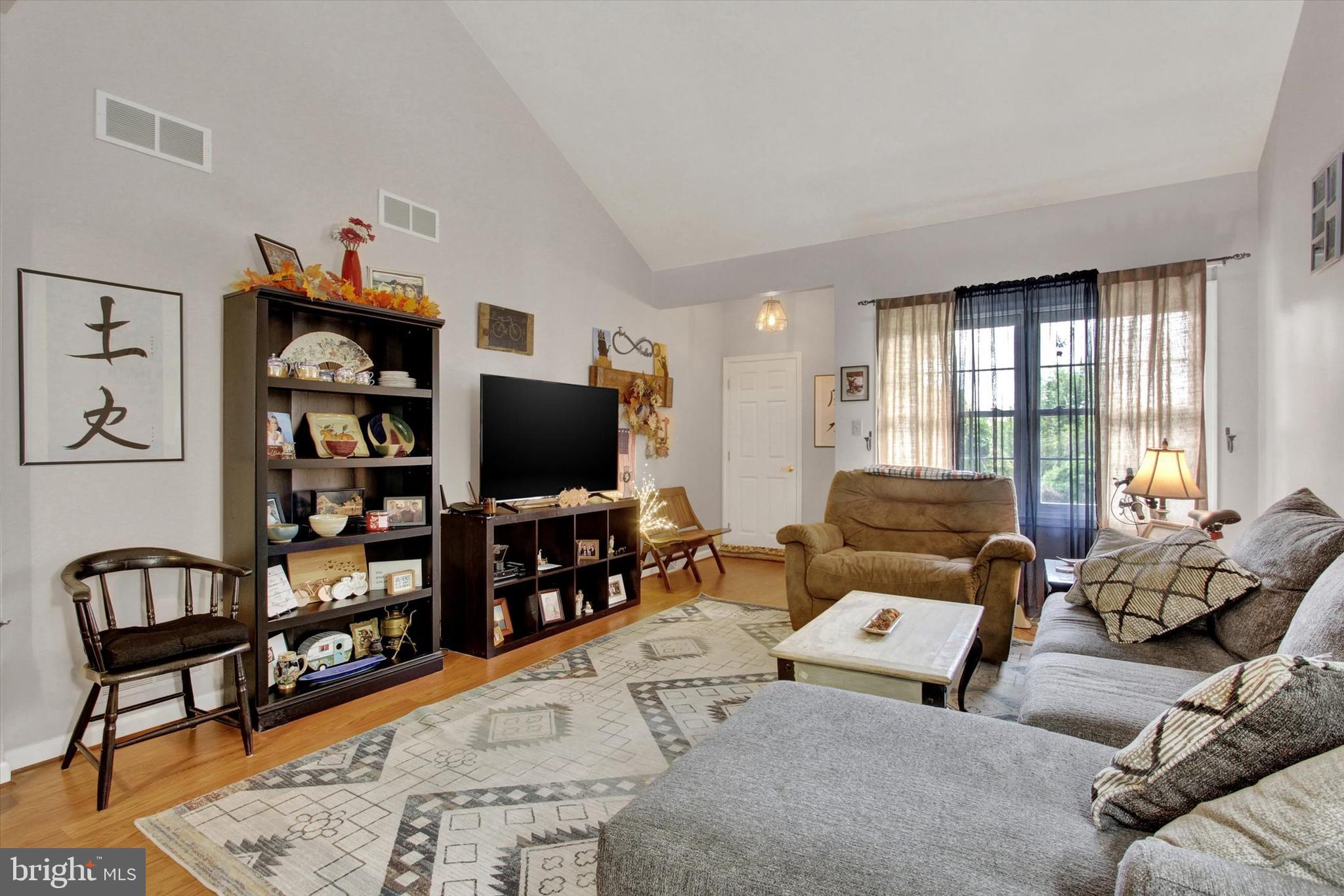 67 Hunters Trail Gettysburg, PA 17325 - Photo 7 of 30 a living room with furniture and a flat screen tv