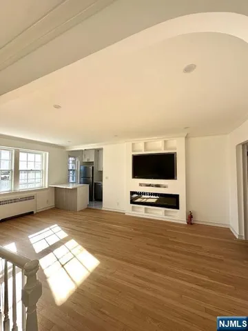 a view of livingroom with furniture and flat screen tv