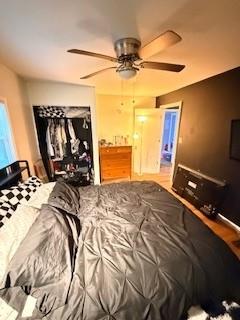 2226 Gary Court Northwest Atlanta, GA 30318 - Photo 5 of 8 a bed sitting in a bedroom and with a flat tv screen next to a window