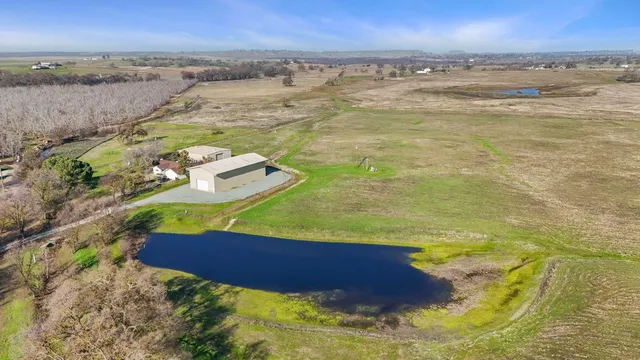 a view of empty room with wooden ceiling