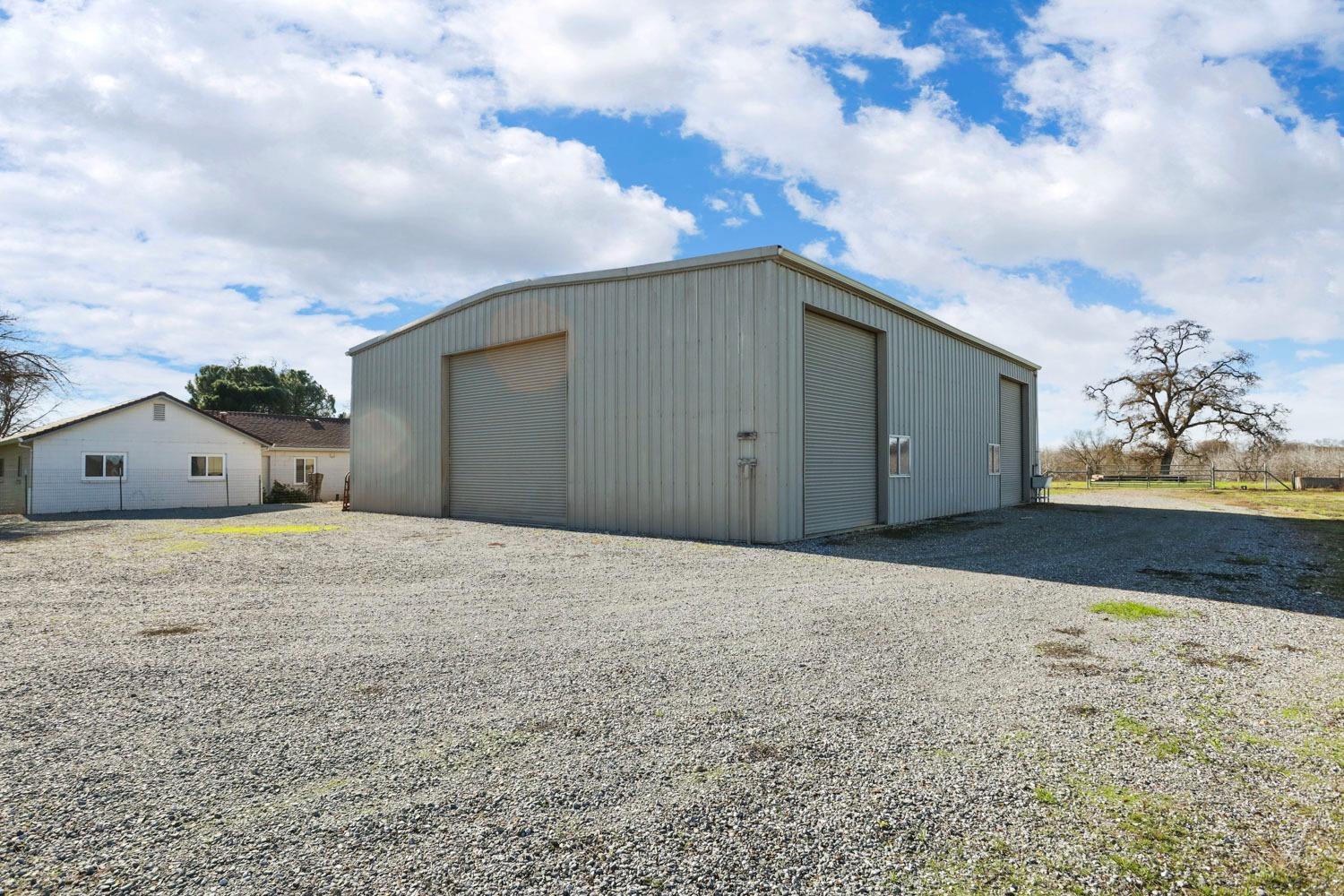 11402 Shelton Road Linden, CA 95236 - Photo 30 of 38 a view of large house with a yard