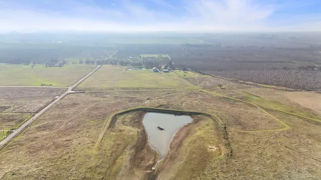 a view of a swimming pool with an outdoor seating