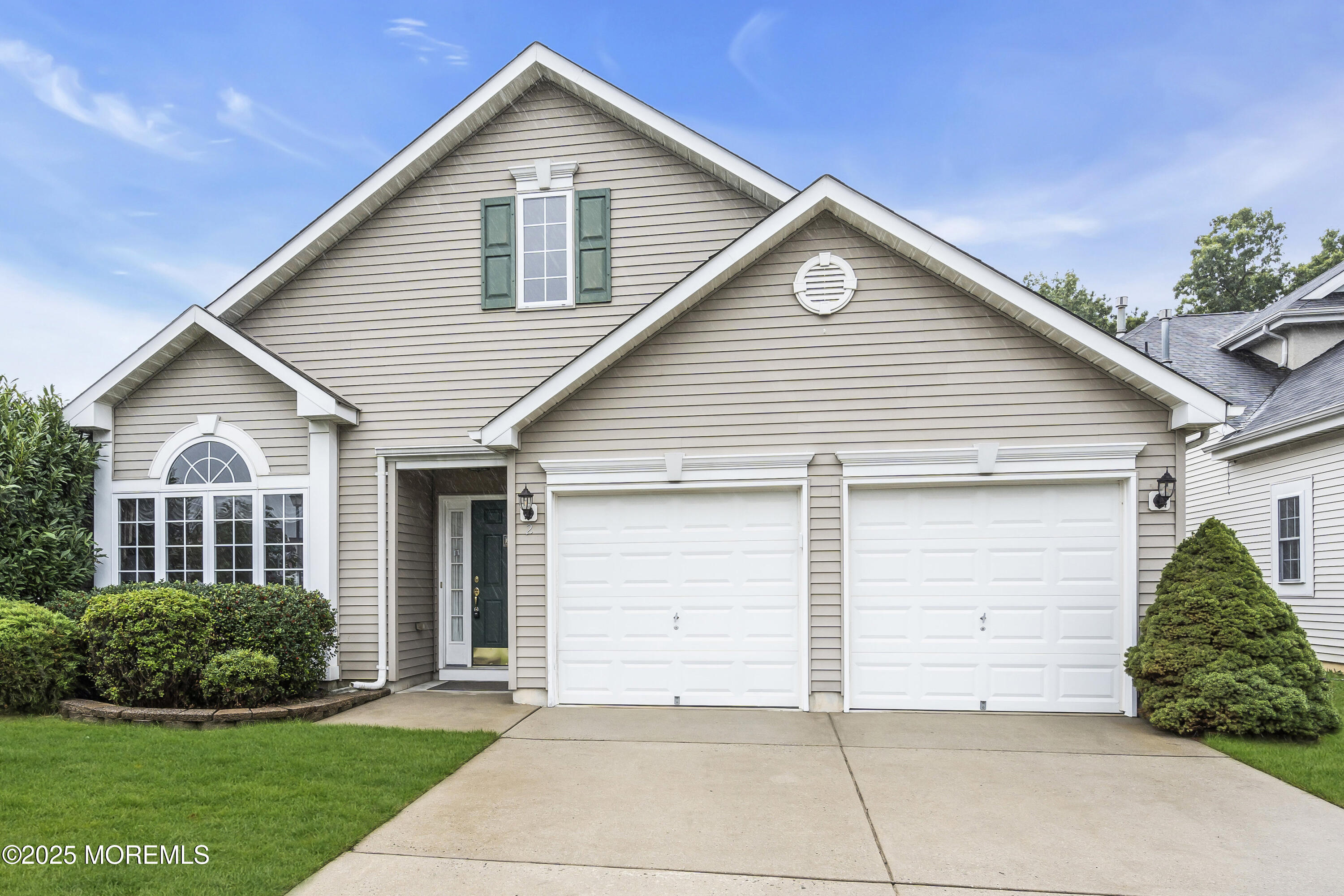 2 Seminole Court Jackson, NJ 08527 - Photo 2 of 32 a view of a white house next to a yard and large trees