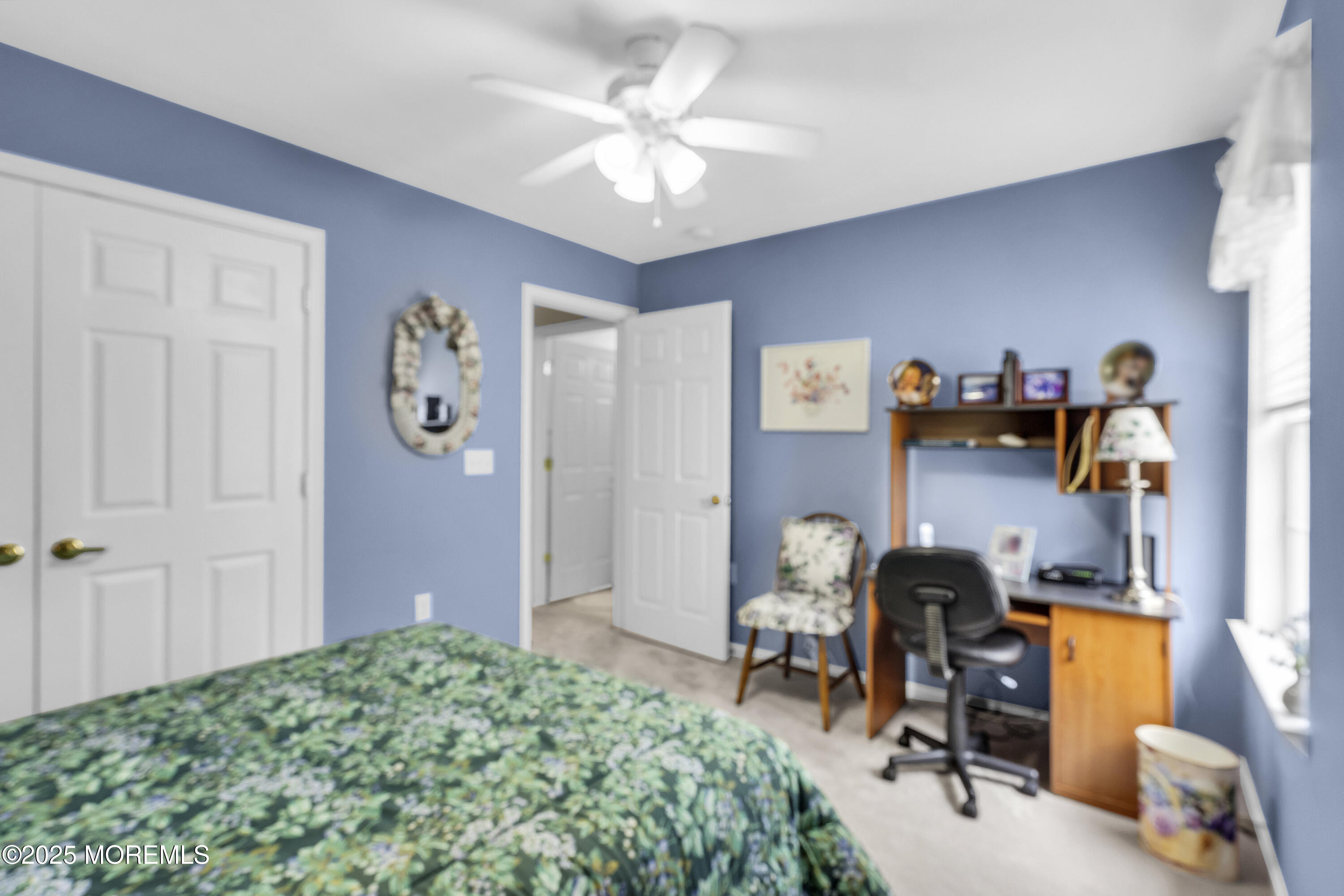 2 Seminole Court Jackson, NJ 08527 - Photo 27 of 32 a bedroom with filled bed and a chandelier
