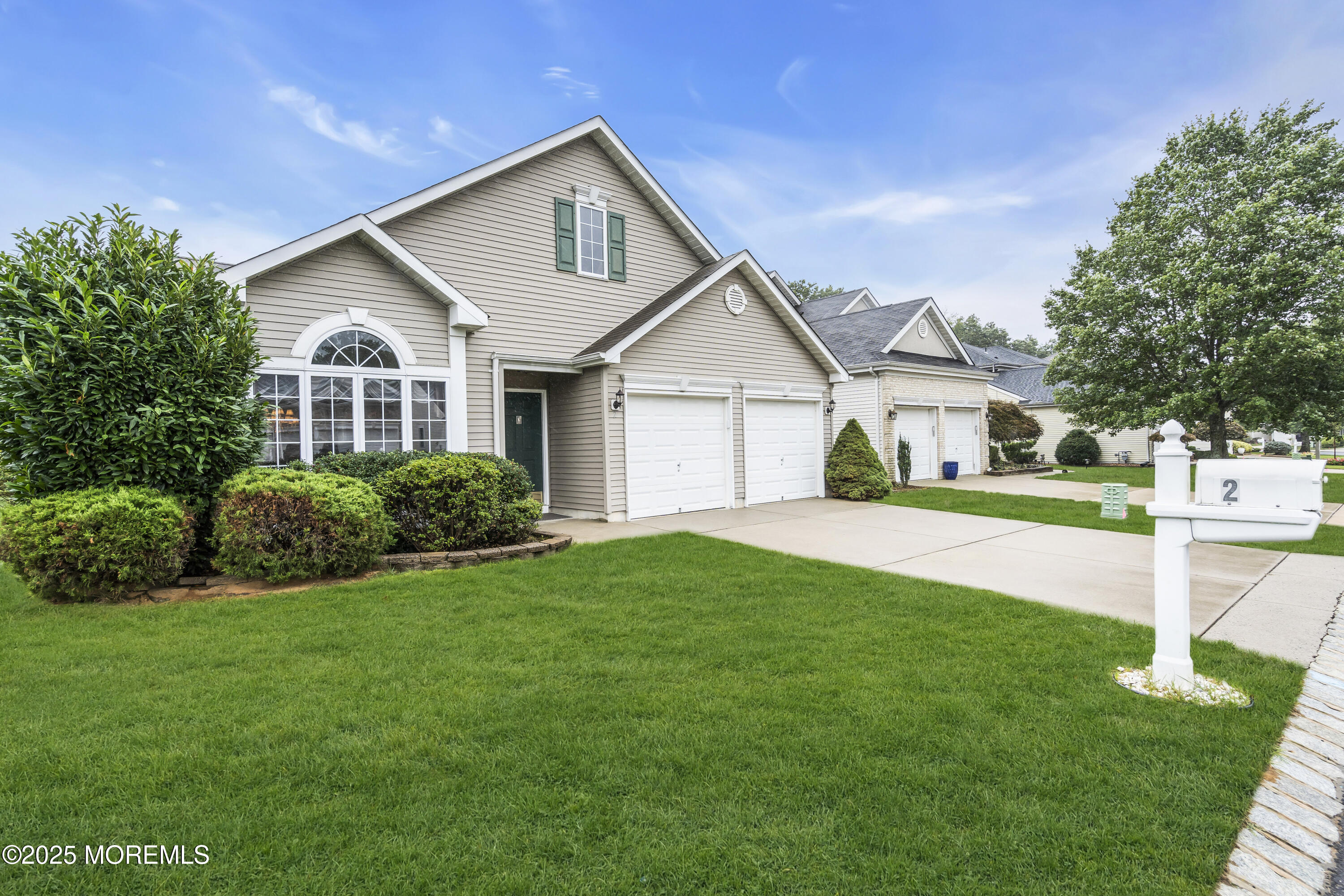 2 Seminole Court Jackson, NJ 08527 - Photo 6 of 32 a front view of a house with a yard and garage