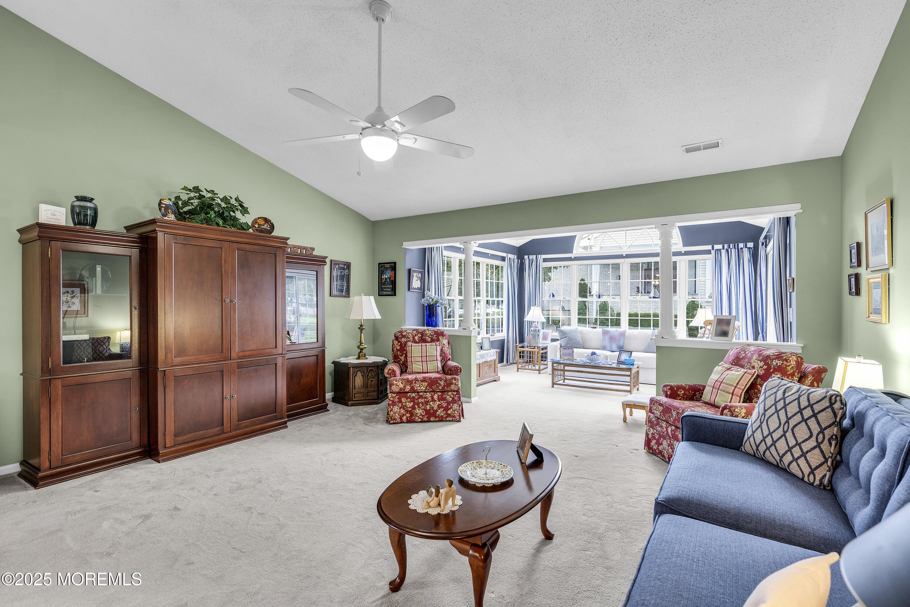 2 Seminole Court Jackson, NJ 08527 - Photo 8 of 32 a living room with furniture a chandelier fan and a window