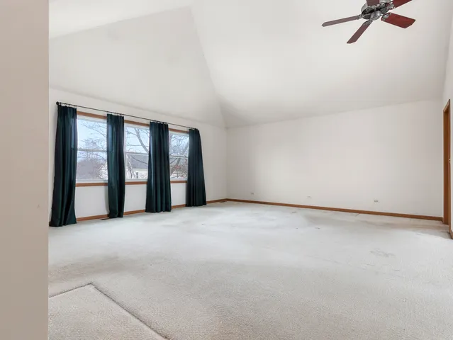 a view of an empty room with a fireplace