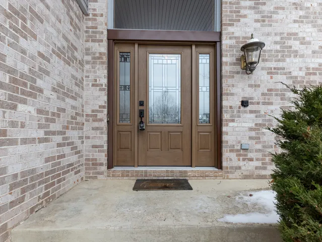 a view of an entryway with wooden floor