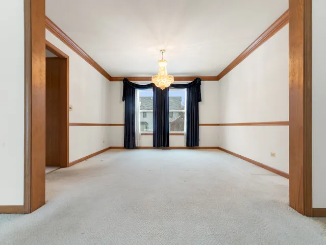 a view of a balcony with furniture and a window