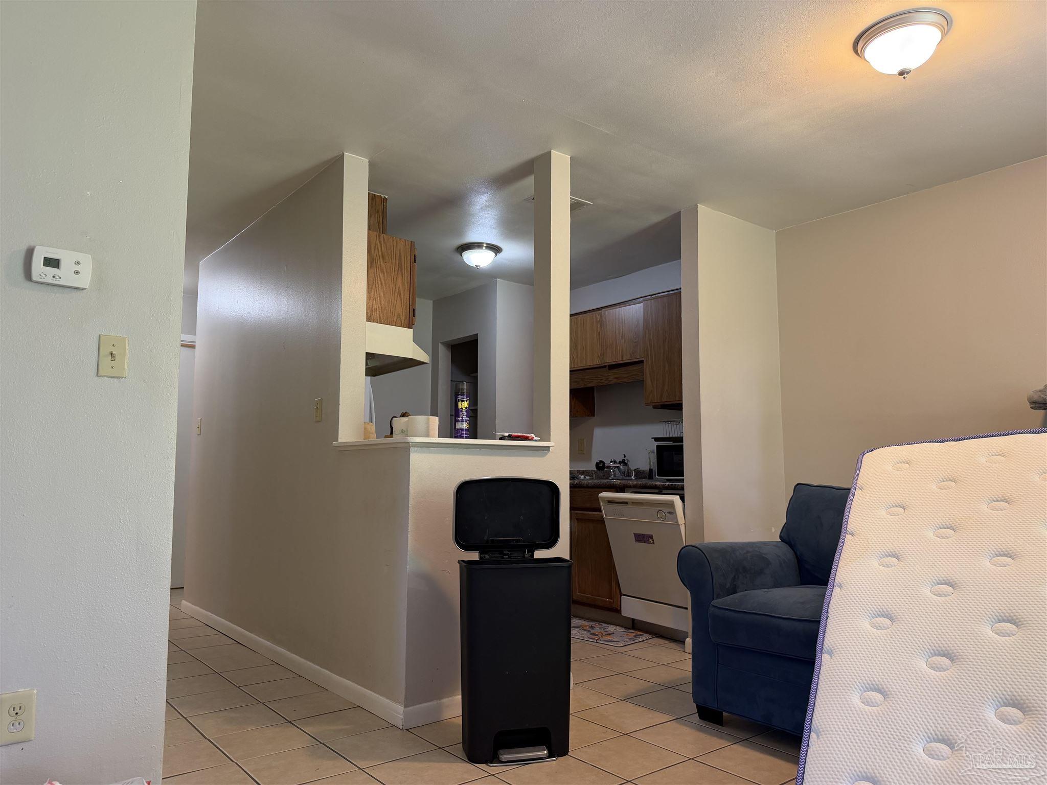 130 East 9 Mile Road, Unit 7 Pensacola, FL 32534 - Photo 11 of 61 a view of kitchen with workspace and living room