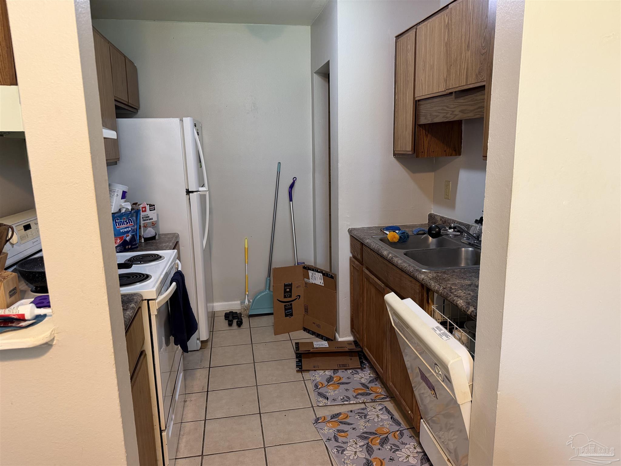 130 East 9 Mile Road, Unit 7 Pensacola, FL 32534 - Photo 12 of 61 a view of walk in closet with clothes and shoes
