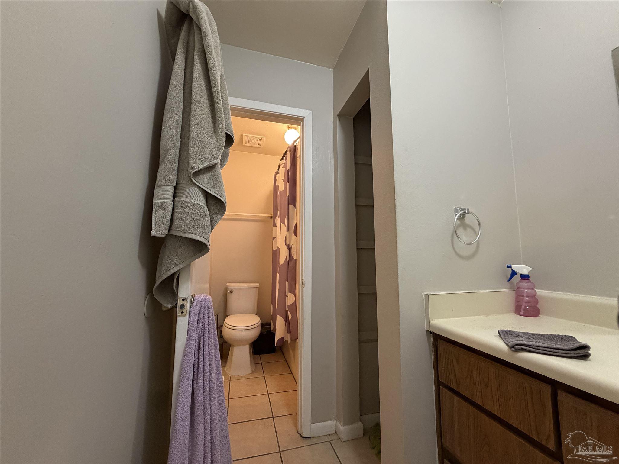 130 East 9 Mile Road, Unit 7 Pensacola, FL 32534 - Photo 19 of 61 a bathroom with a sink and a mirror