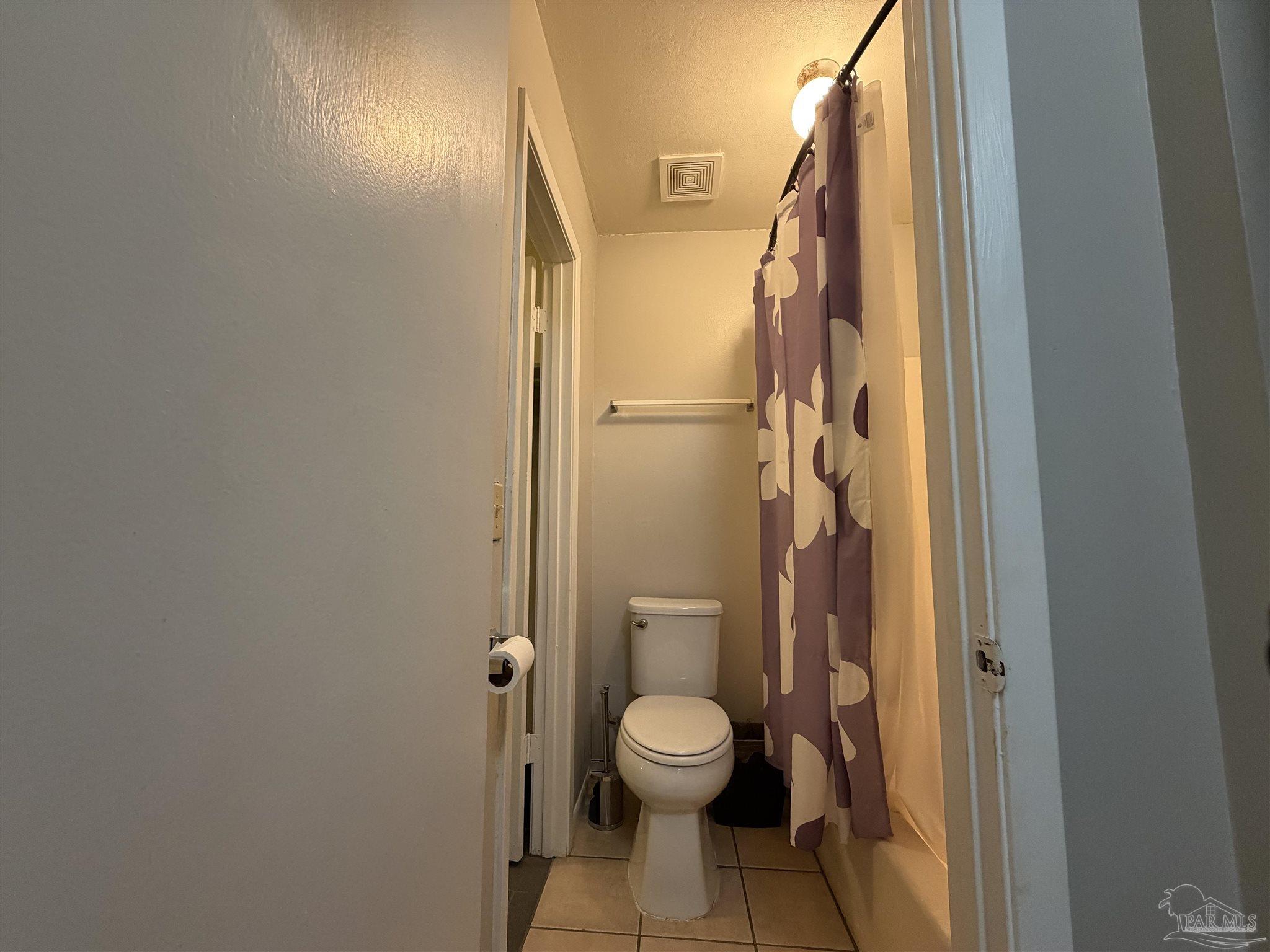 130 East 9 Mile Road, Unit 7 Pensacola, FL 32534 - Photo 20 of 61 a bathroom with a toilet and a shower