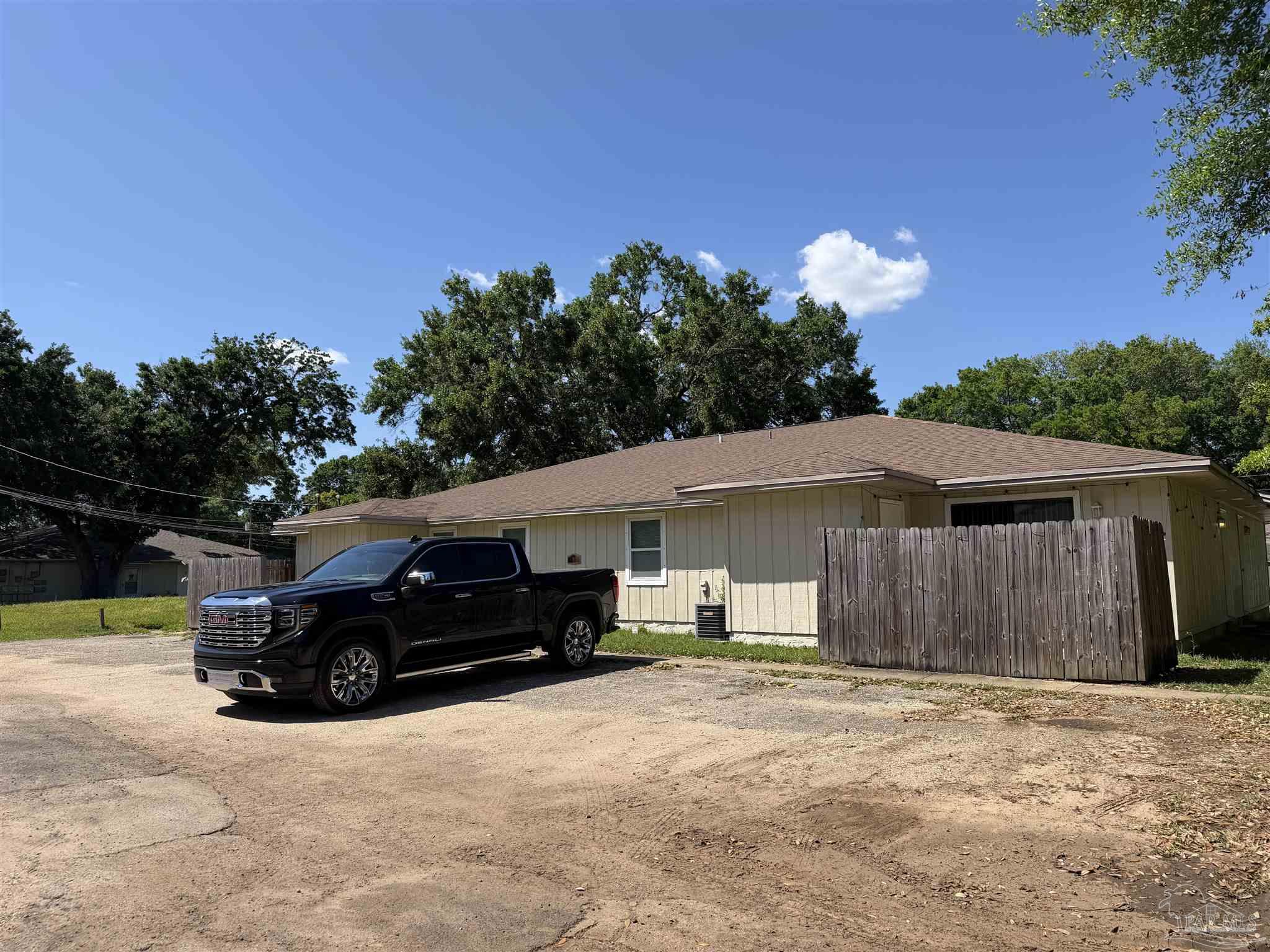 130 East 9 Mile Road, Unit 7 Pensacola, FL 32534 - Photo 2 of 61 a car parked in front of a house