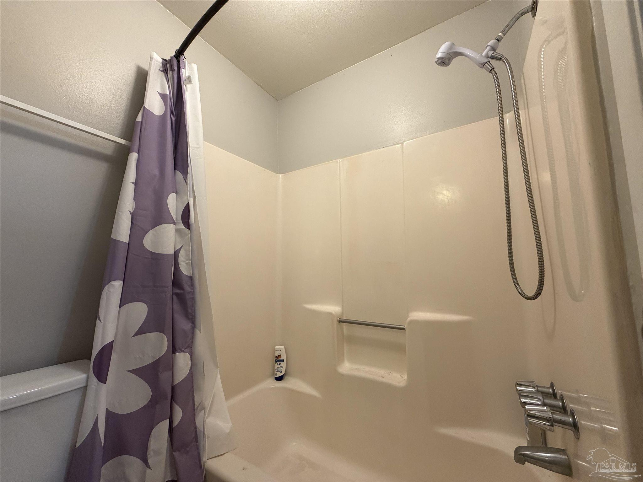 130 East 9 Mile Road, Unit 7 Pensacola, FL 32534 - Photo 22 of 61 a bathroom with a shower and a toilet