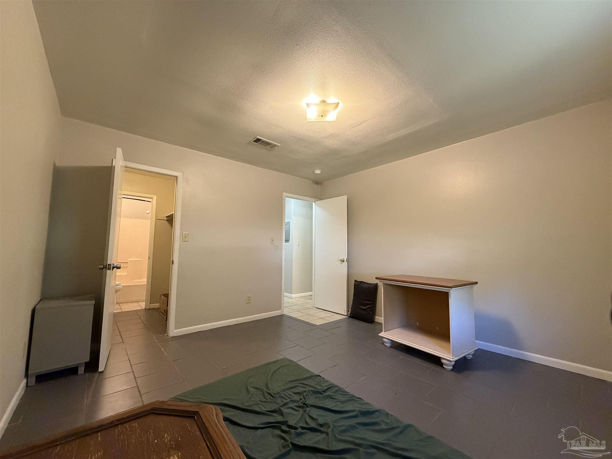 130 East 9 Mile Road, Unit 7 Pensacola, FL 32534 - Photo 26 of 61 a living room with furniture and a fireplace