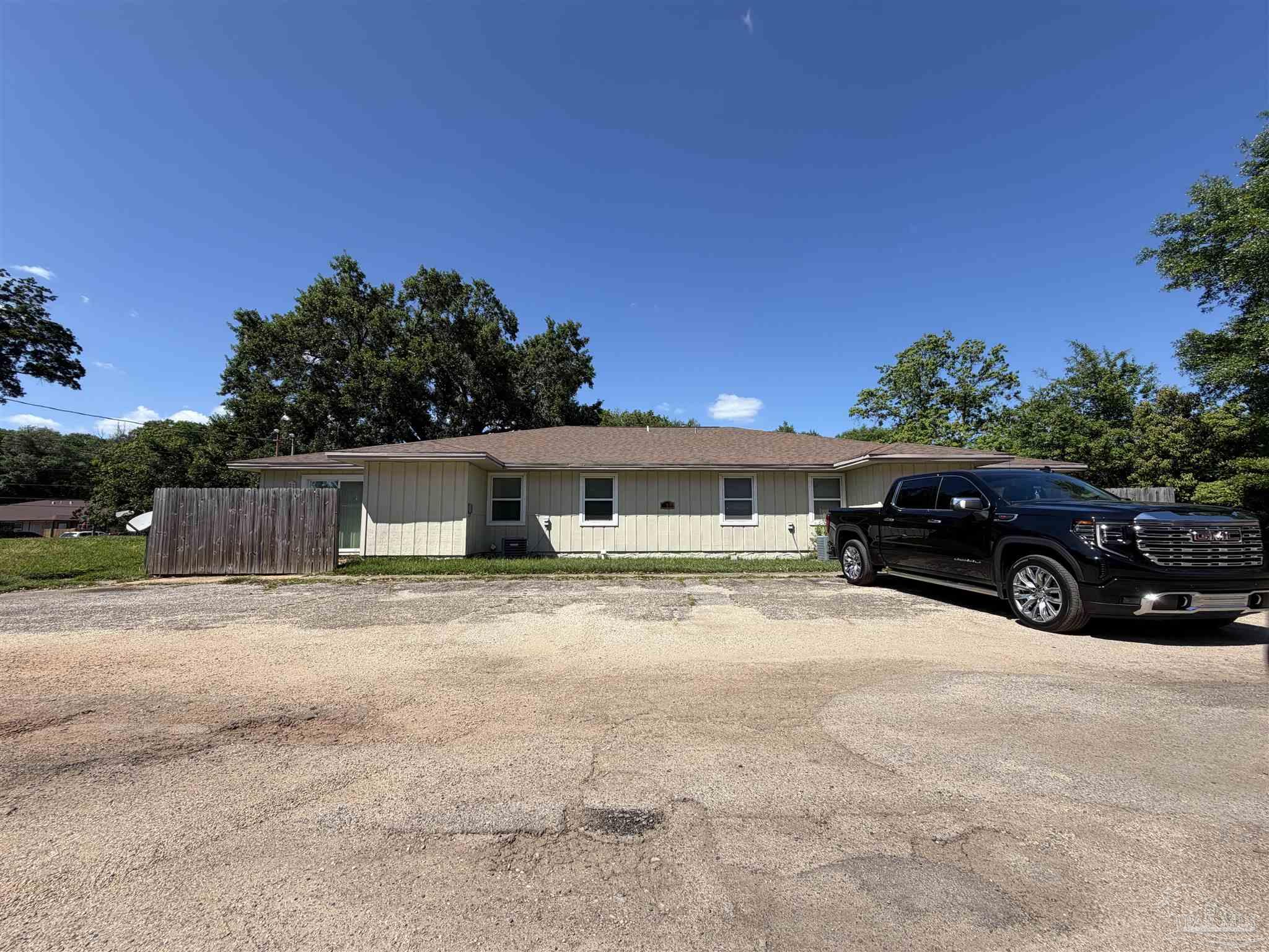 130 East 9 Mile Road, Unit 7 Pensacola, FL 32534 - Photo 28 of 61 a view of a car in front of a house