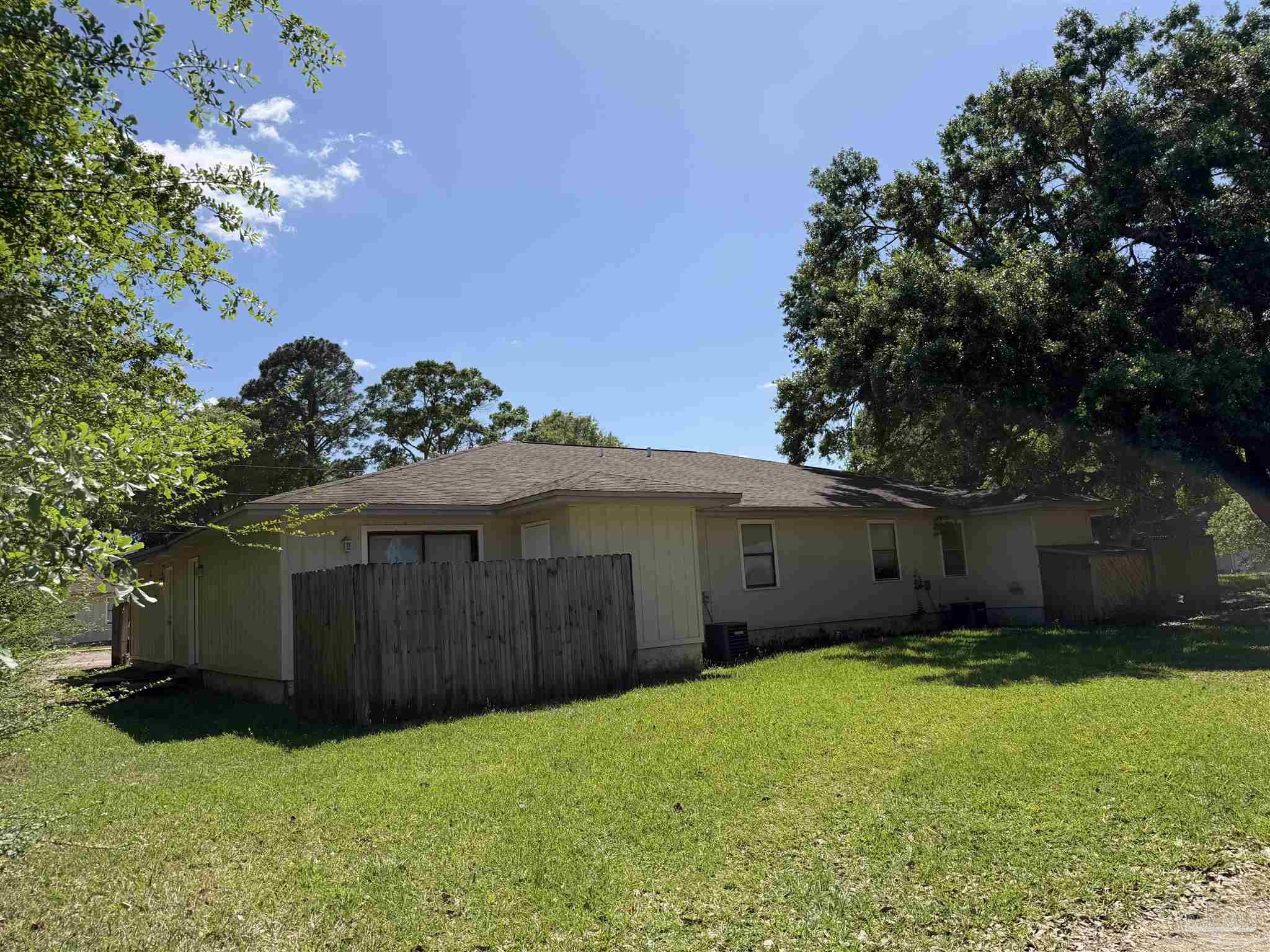 130 East 9 Mile Road, Unit 7 Pensacola, FL 32534 - Photo 3 of 61 a view of a house with a yard