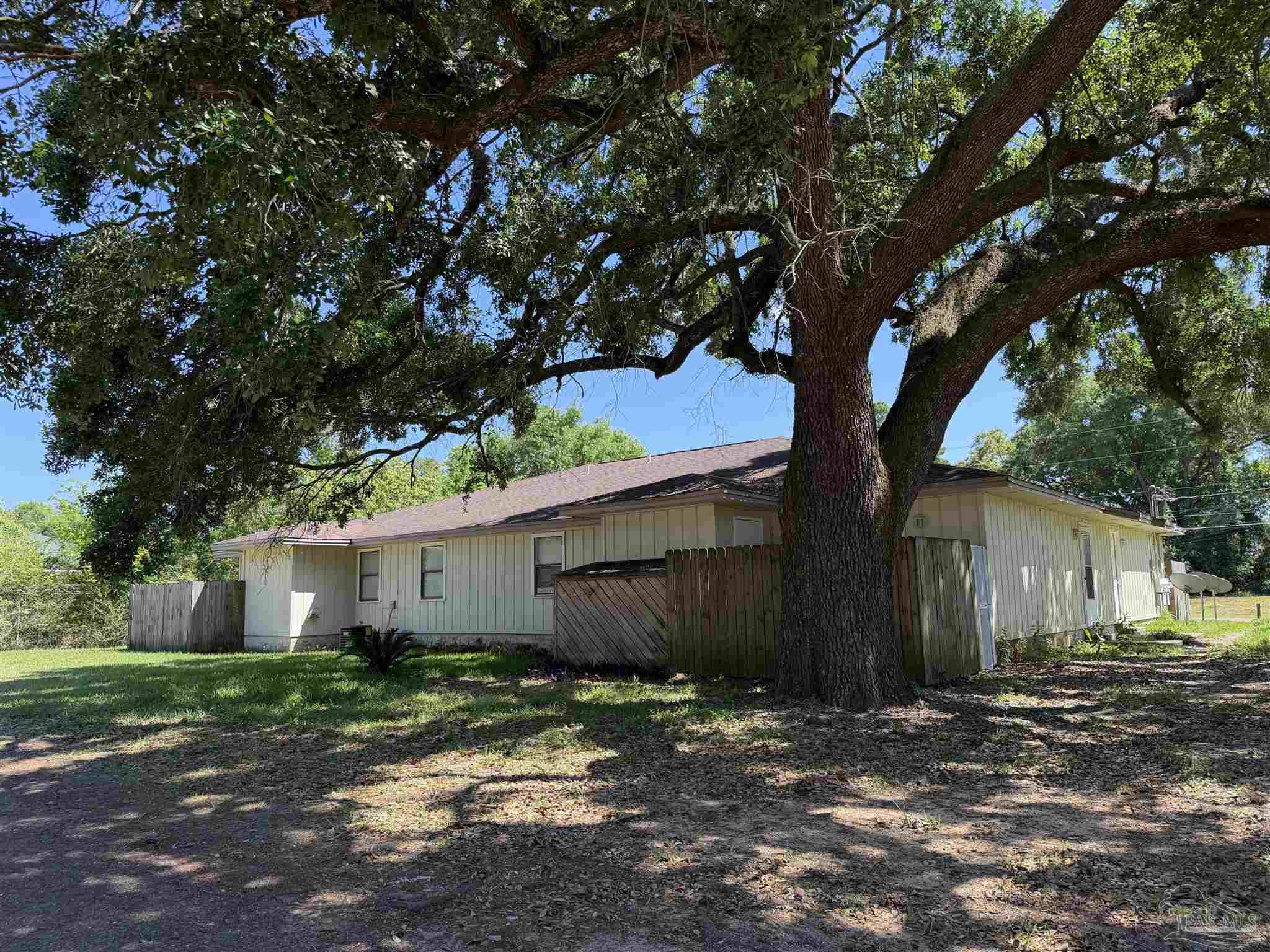 130 East 9 Mile Road, Unit 7 Pensacola, FL 32534 - Photo 4 of 61 a view of a house with a tree