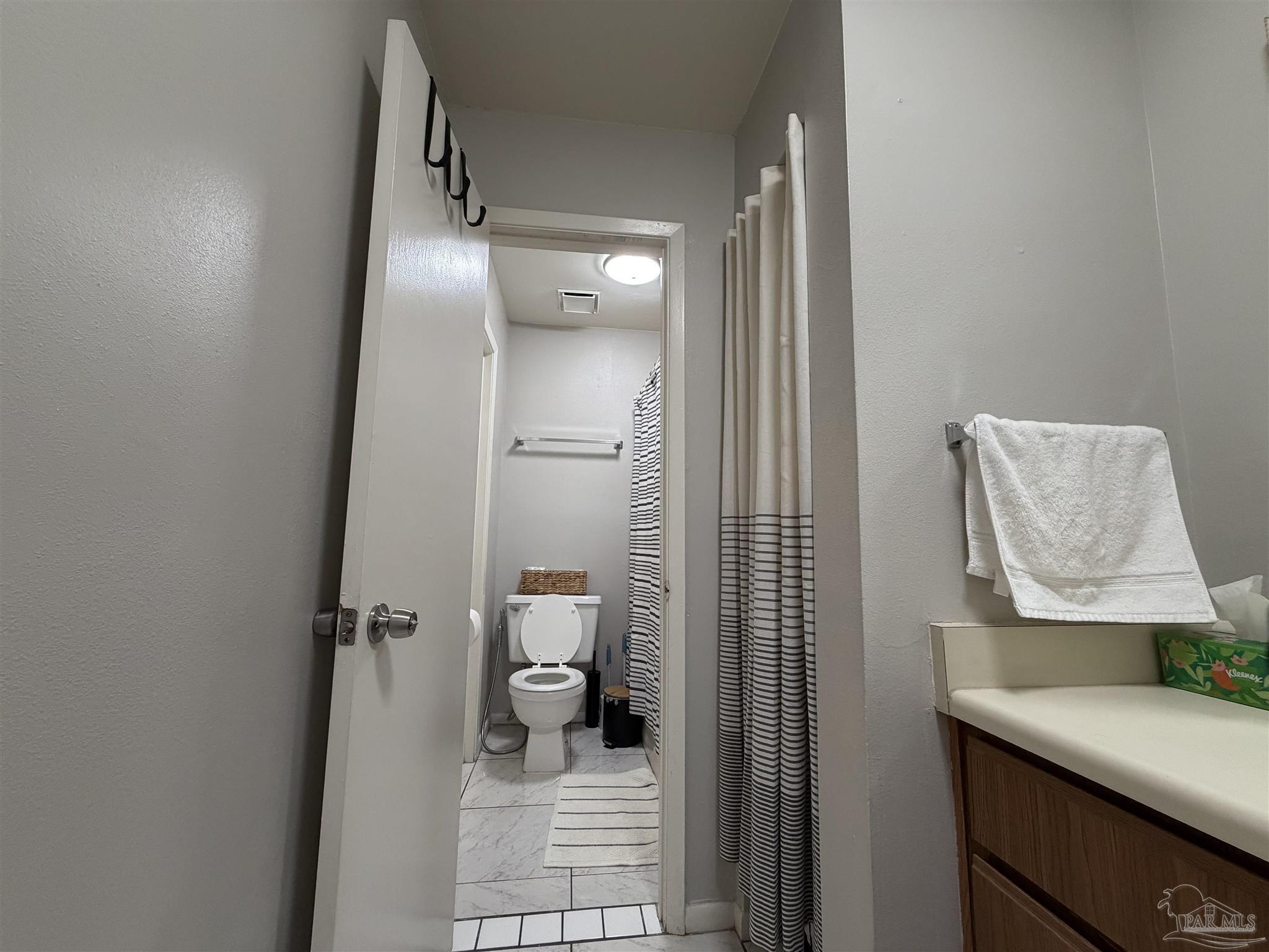 130 East 9 Mile Road, Unit 7 Pensacola, FL 32534 - Photo 43 of 61 a bathroom with a toilet and a sink