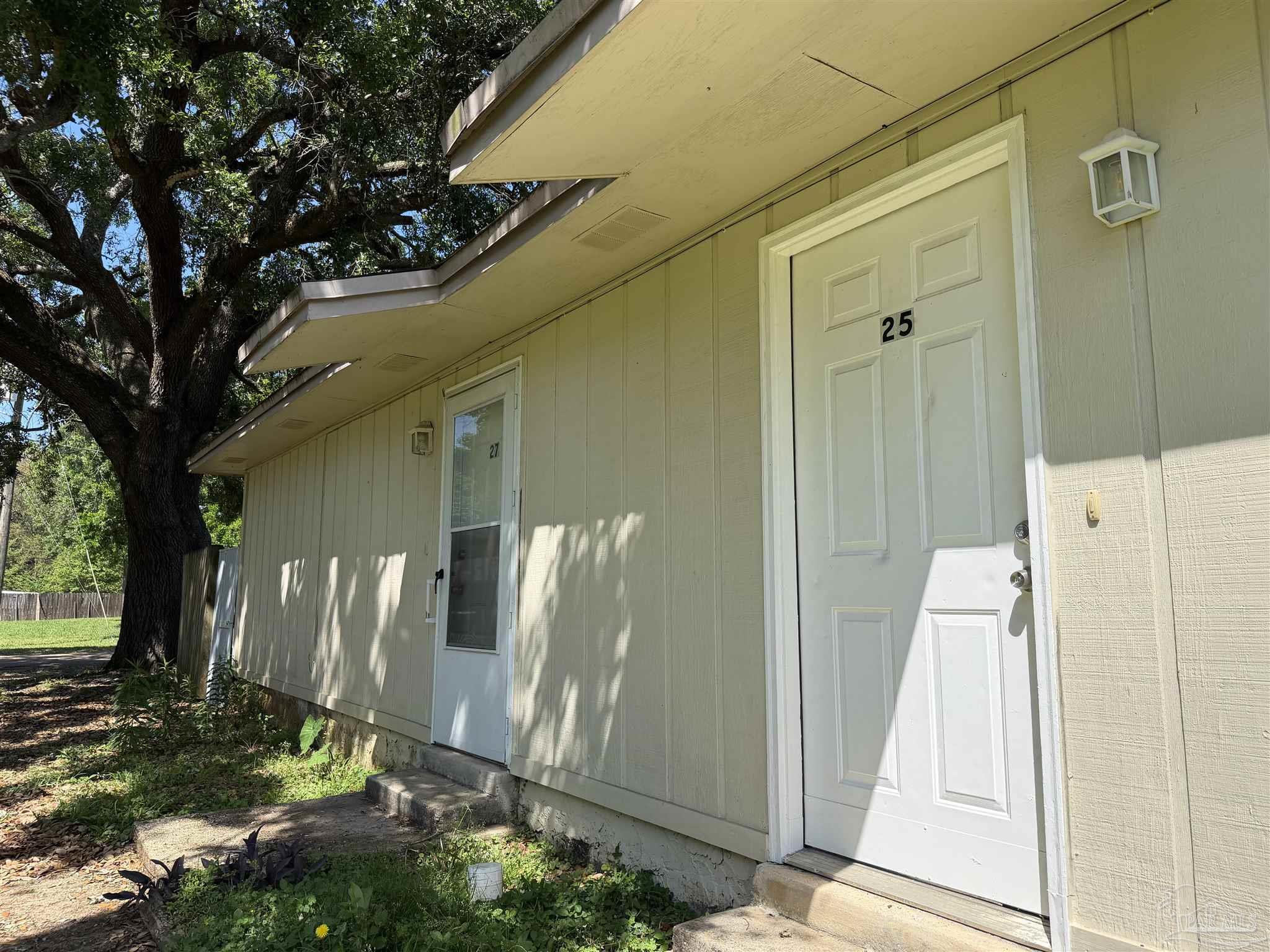 130 East 9 Mile Road, Unit 7 Pensacola, FL 32534 - Photo 5 of 61 a view of a back yard