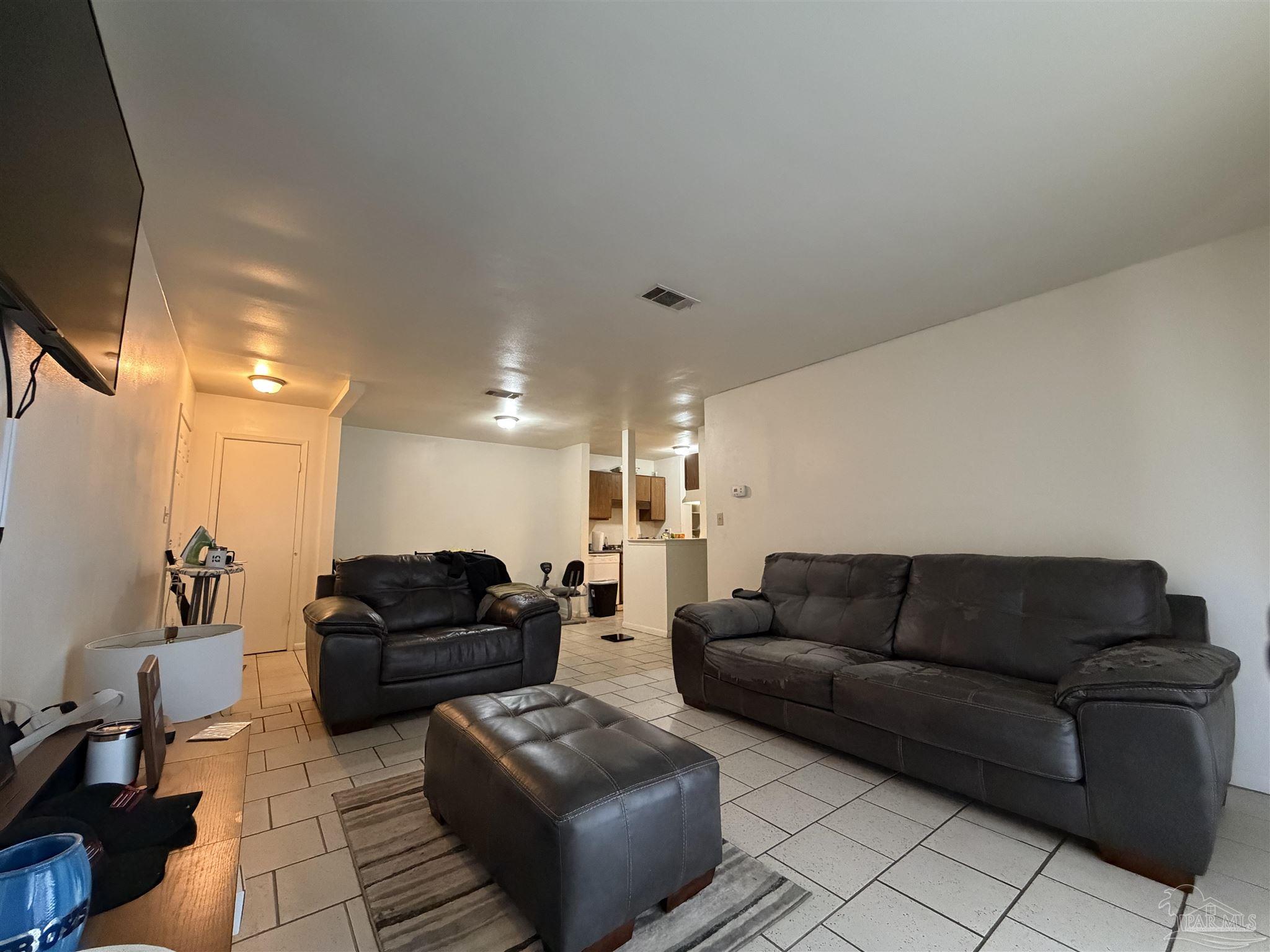 130 East 9 Mile Road, Unit 7 Pensacola, FL 32534 - Photo 52 of 61 a living room with furniture