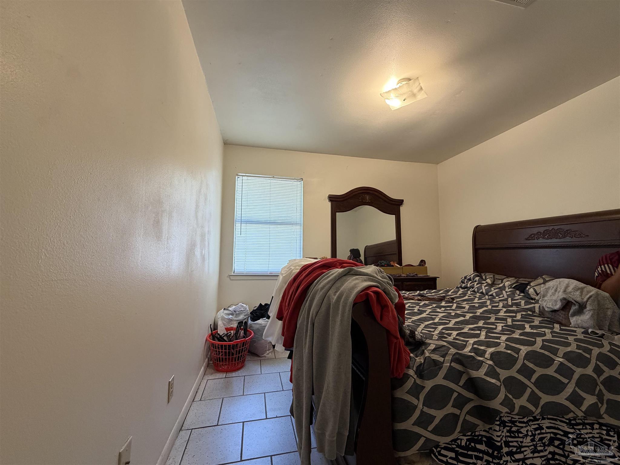 130 East 9 Mile Road, Unit 7 Pensacola, FL 32534 - Photo 54 of 61 a bedroom with a bed and a dresser