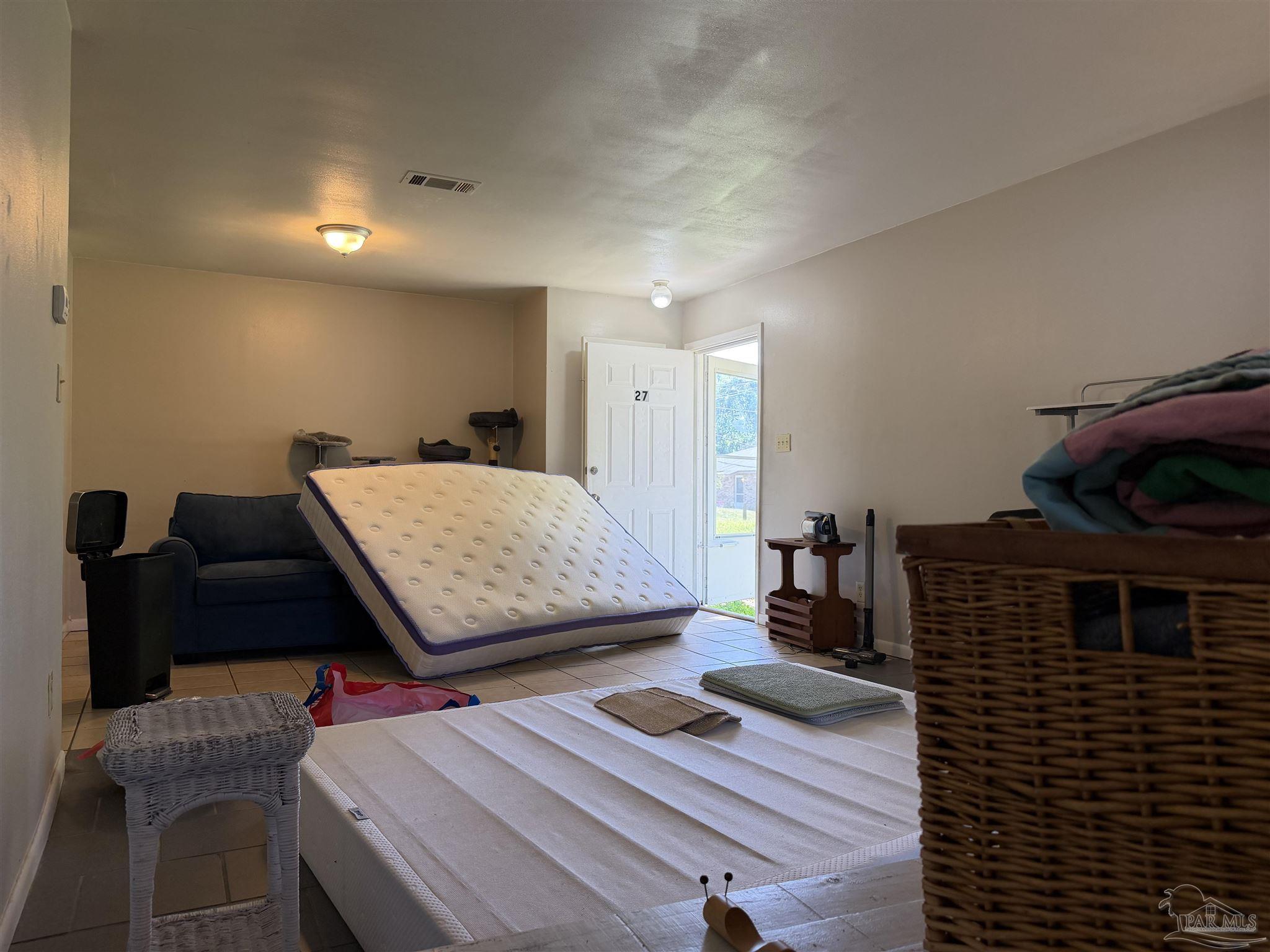 130 East 9 Mile Road, Unit 7 Pensacola, FL 32534 - Photo 8 of 61 a living room with furniture and a fireplace