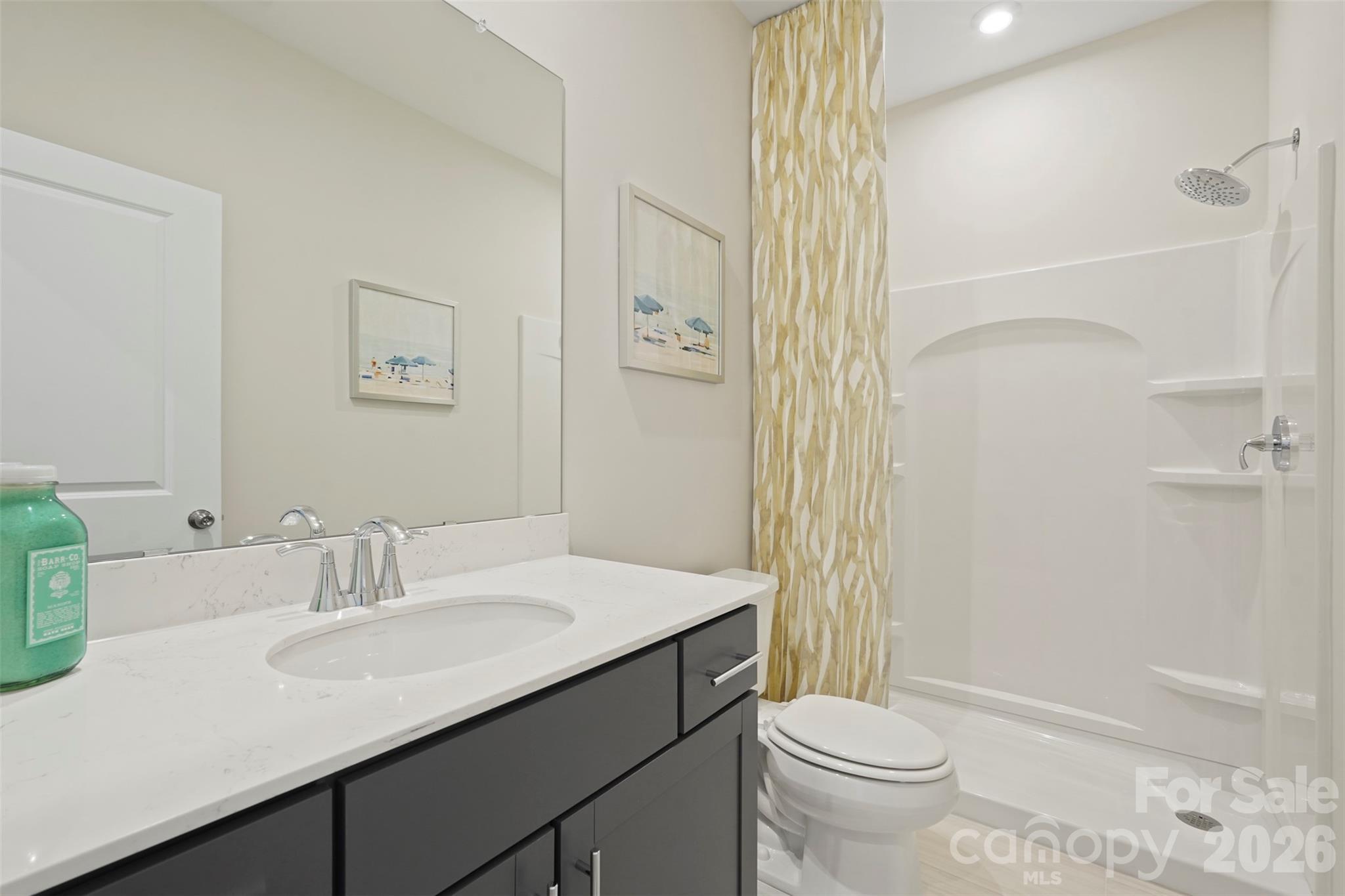 1099 Arundle Road Sherrills Ford, NC 28673 - Photo 17 of 40 a bathroom with a sink a toilet and shower