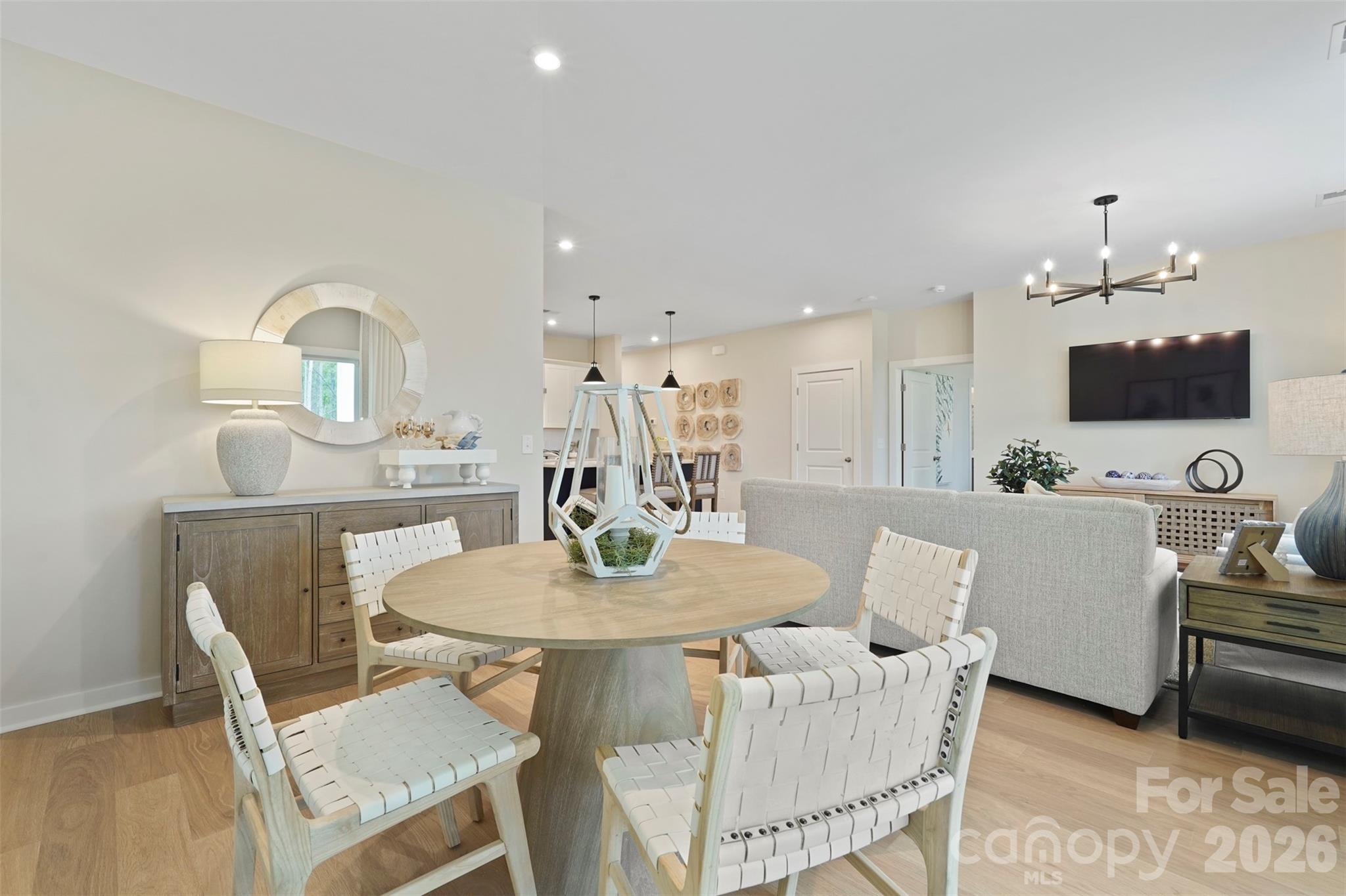 1099 Arundle Road Sherrills Ford, NC 28673 - Photo 24 of 40 a view of a dining room with furniture and a flat screen tv