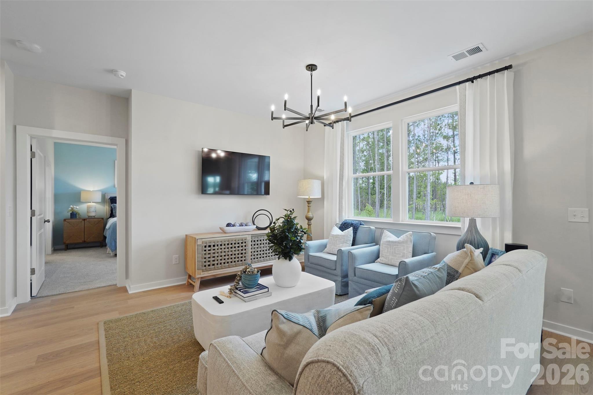 1099 Arundle Road Sherrills Ford, NC 28673 - Photo 27 of 40 a living room with furniture a window and a flat screen tv