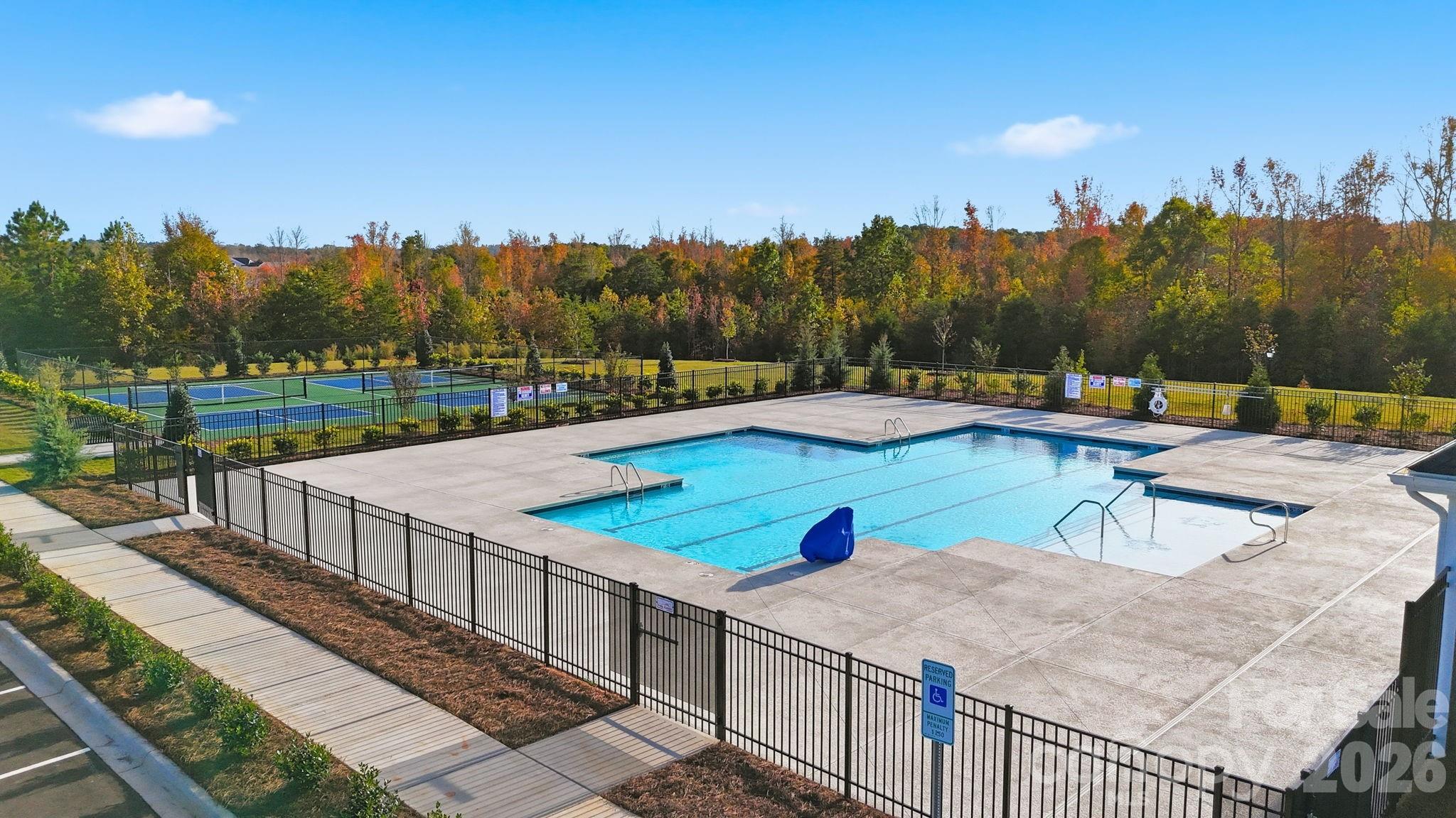 1099 Arundle Road Sherrills Ford, NC 28673 - Photo 33 of 40 a view of a swimming pool with an outdoor seating and a garden