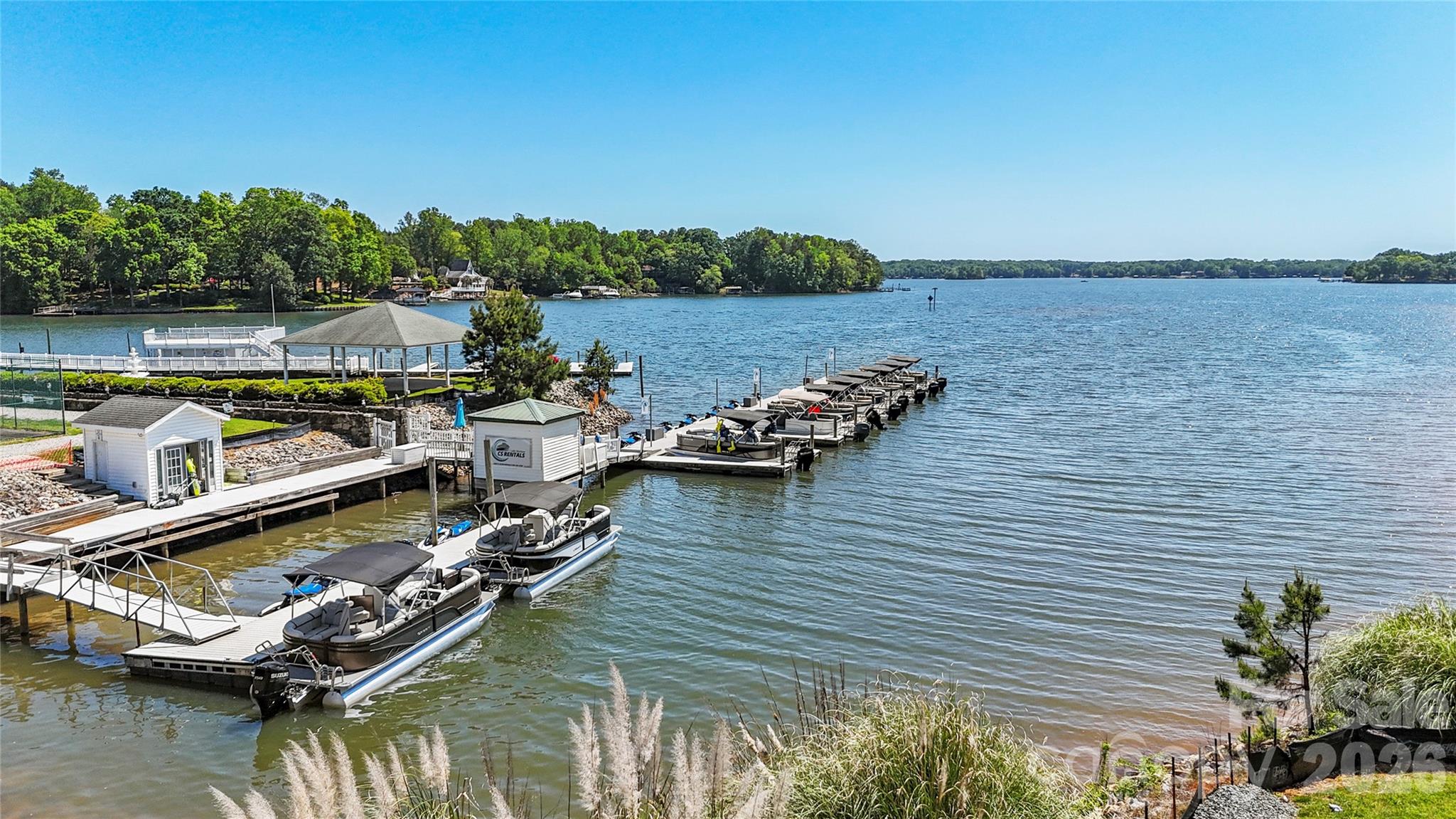 1099 Arundle Road Sherrills Ford, NC 28673 - Photo 37 of 40 a view of an ocean with boats and trees in the background