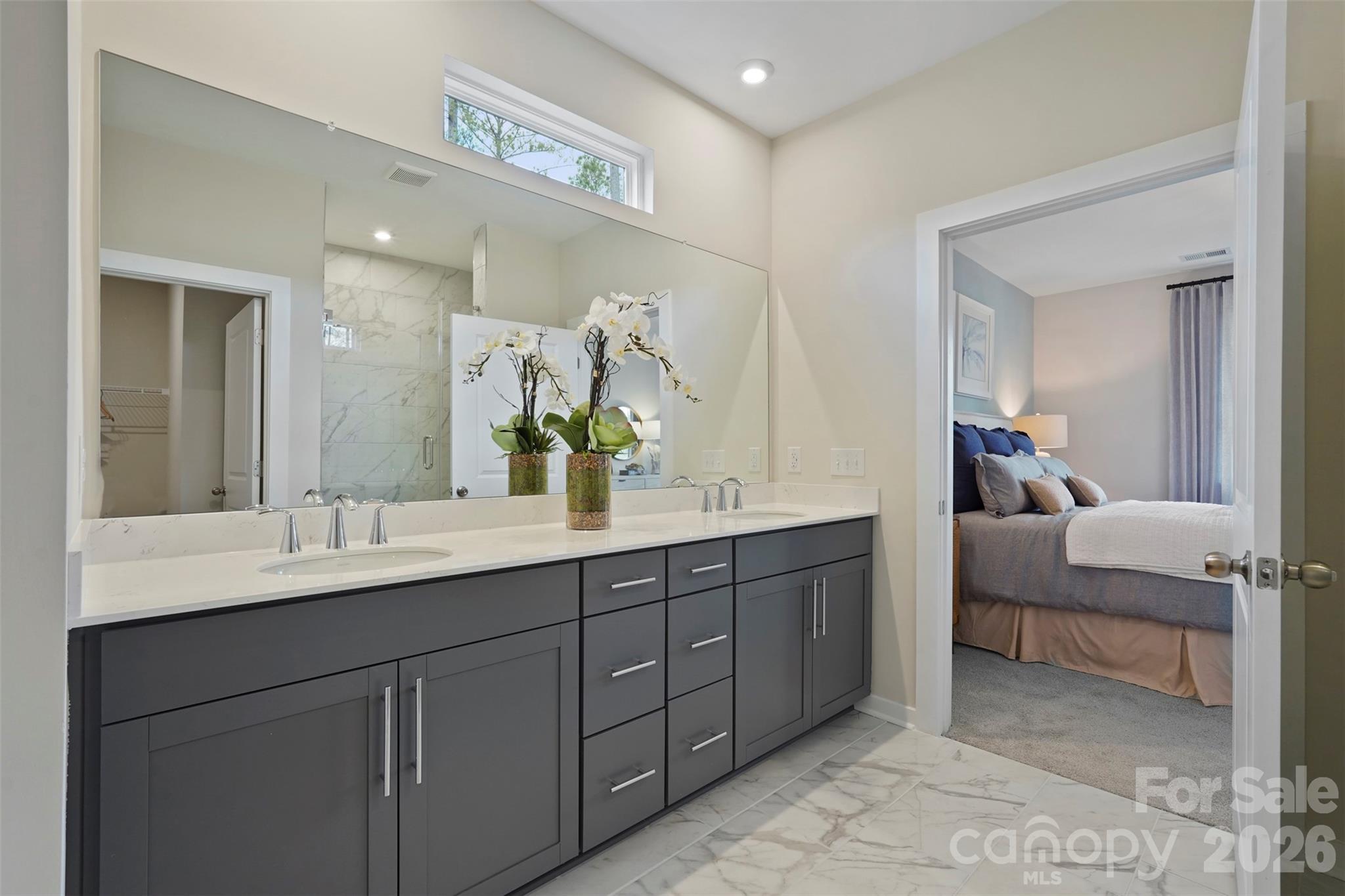 1099 Arundle Road Sherrills Ford, NC 28673 - Photo 7 of 40 a en suite bathroom with double sink and a mirror