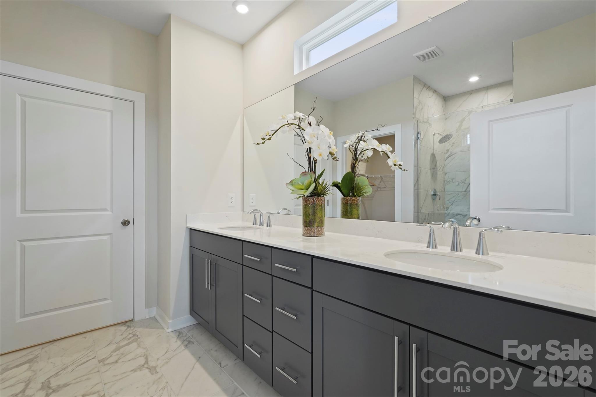 1099 Arundle Road Sherrills Ford, NC 28673 - Photo 8 of 40 a bathroom with a double vanity sink and a mirror