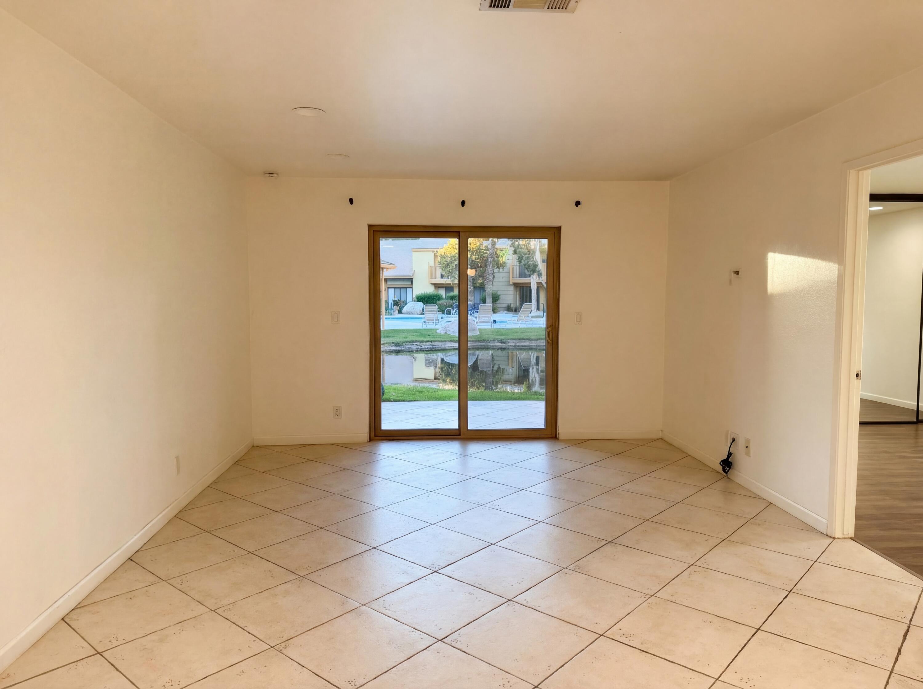 48255 Monroe Street, Unit 20 Indio, CA 92201 - Photo 8 of 21 a view of an empty room with a window