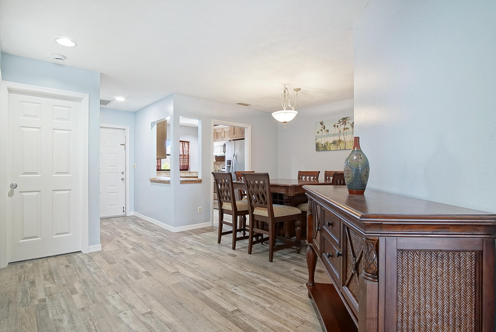 6041 Southeast Landing Way Stuart, FL 34997 - Photo 14 of 30 a view of a dining room with furniture and wooden floor