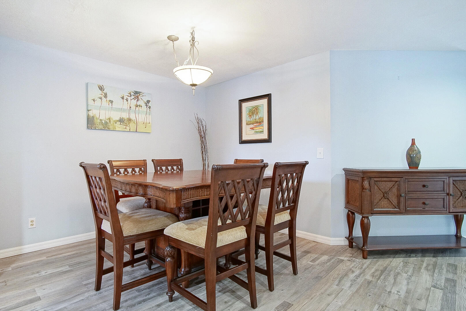 6041 Southeast Landing Way Stuart, FL 34997 - Photo 19 of 30 a view of a dining room with furniture and wooden floor