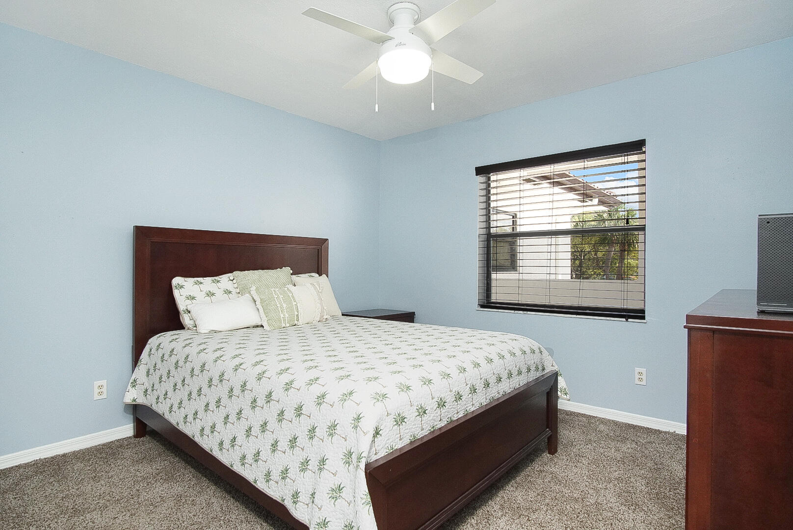 6041 Southeast Landing Way Stuart, FL 34997 - Photo 22 of 30 a bedroom with a bed and a window