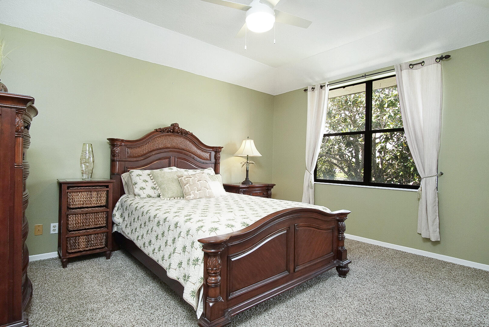 6041 Southeast Landing Way Stuart, FL 34997 - Photo 3 of 30 a bedroom with a bed lamp and window