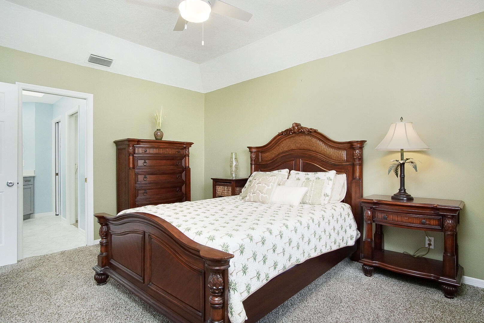 6041 Southeast Landing Way Stuart, FL 34997 - Photo 4 of 30 a bedroom with a bed and a fireplace