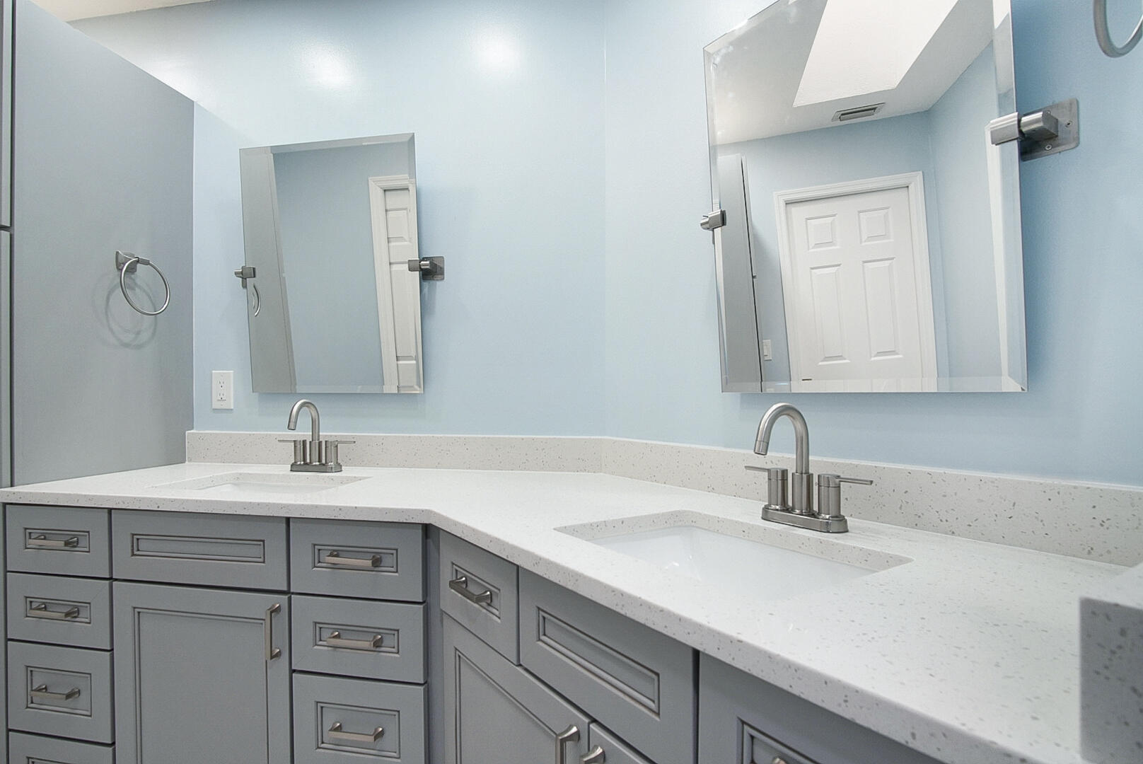 6041 Southeast Landing Way Stuart, FL 34997 - Photo 8 of 30 a bathroom with a sink and a mirror